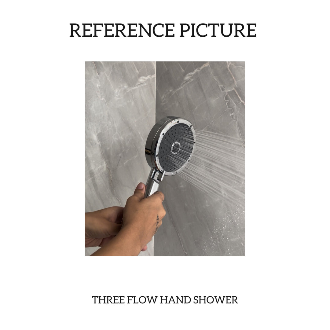 Elegant hand shower with a brushed nickel finish, installed in a luxurious bathroom setting