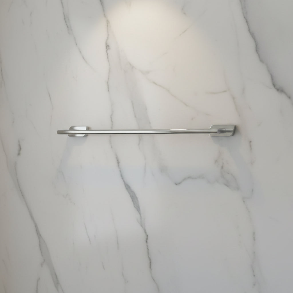 Chrome towel bar mounted on a white tiled wall