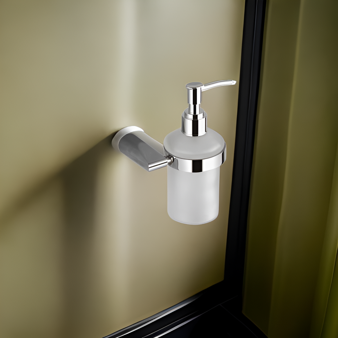 Modern stainless steel liquid soap dispenser with a sleek pump, placed on a bathroom sink