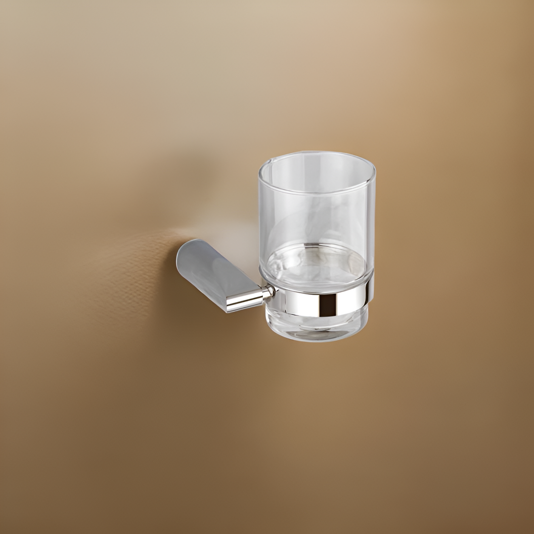 Stylish tumbler holder mounted on a bathroom wall, holding a toothbrush and toothpaste