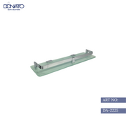 Frameless glass shelf in a luxury retail store showcasing products