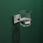 Modern tumbler holder with a sleek design, featuring a glass tumbler for easy access