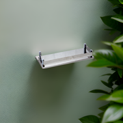 Minimalist acrylic shelf with rounded edges, enhancing a contemporary decor