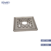 Intricate metal grating pattern used as a decorative element in modern architecture